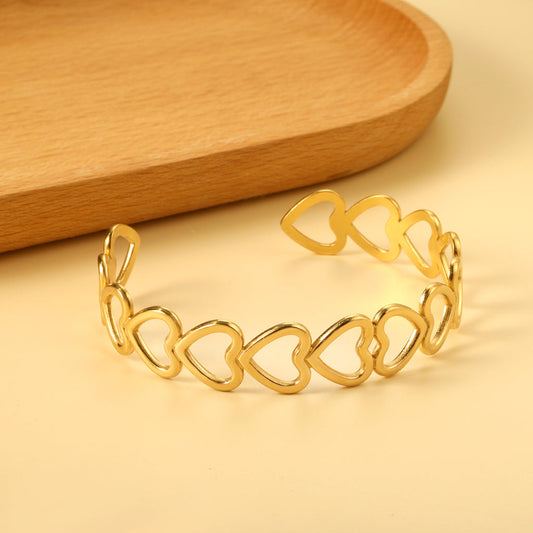 ZANORA  - Multiple Openings In The Shape Of Hollowed-Out Hearts Linked Together Bangle