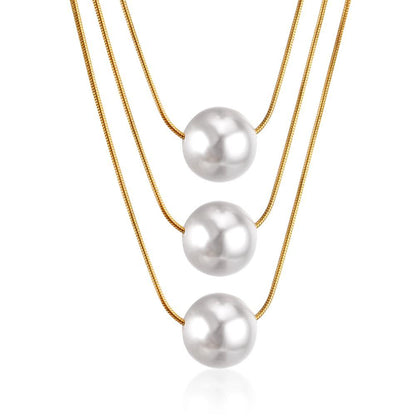ZANORA  - Triple Layered Pearl Pendant Necklace